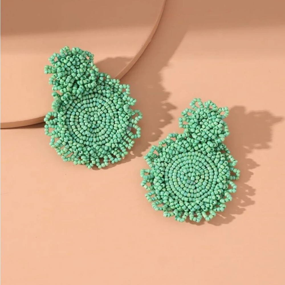 Green beaded dangle earrings